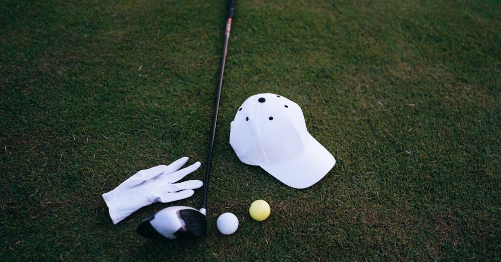Close-up of golf club, balls, glove, and cap placed on green grass, perfect for a golf day.